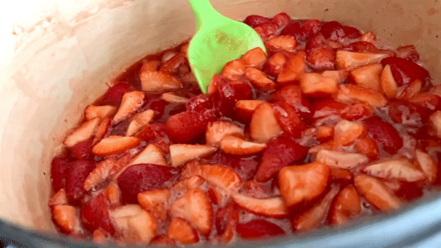 Strawberry jam stirring